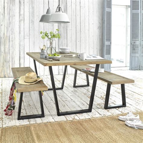 A table has upright legs, stretchers, a ladder shelf. Industrial Style Reclaimed Wood Table