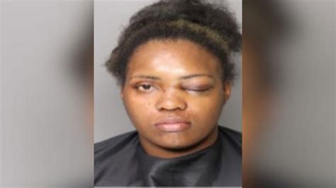 woman arrested after hitting man with vehicle police say