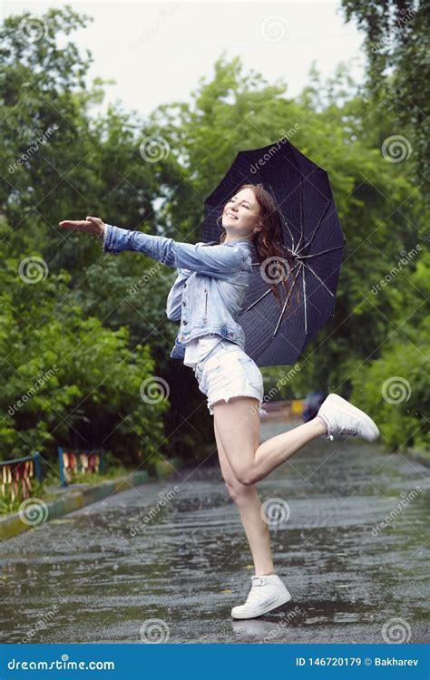 Cheerful Woman With An Umbrella Walking In The Rain Stock Image Image Of Young Street 146720179