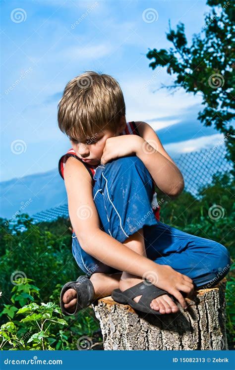 Sad Little Boy Sitting On A Stump Stock Image Image Of Hair Little