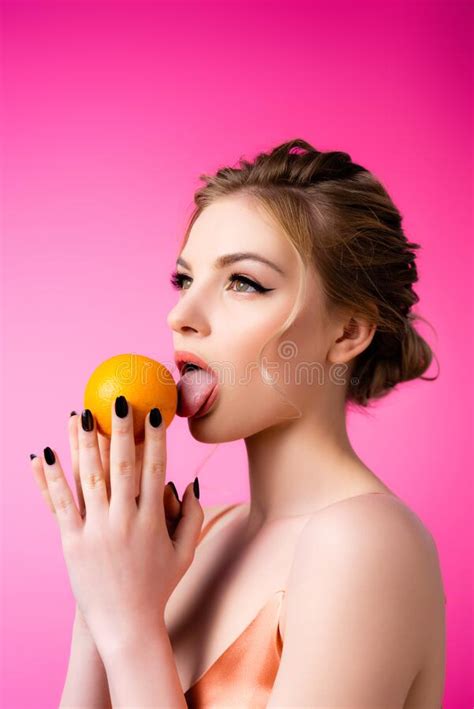 elegant beautiful blonde woman licking ripe stock image image of orange fashionable 192500877