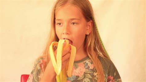 Cute Girl Eating Banana Royalty Free Video