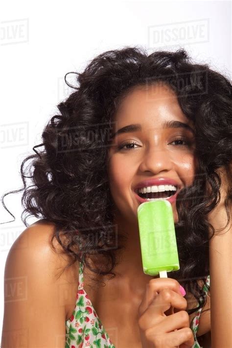 Babe Woman Eating Green Popsicle Portrait Stock Photo Dissolve