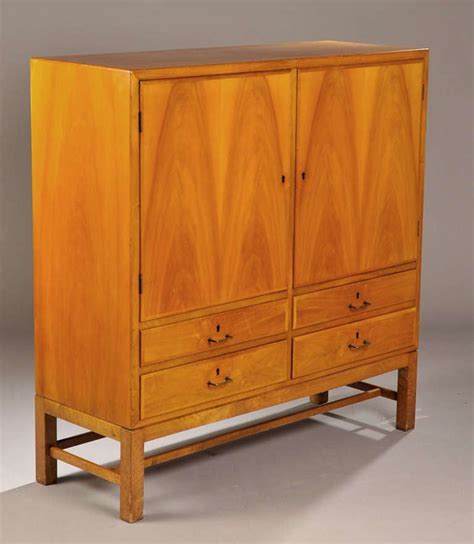 The clean lines, solid wood construction, craftsmanship and attention to detail. 1940s Danish Modern Walnut Cabinet at 1stdibs