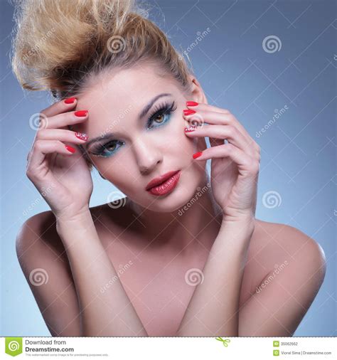 Classic Pose Of A Beauty Woman With Hands On Face Stock