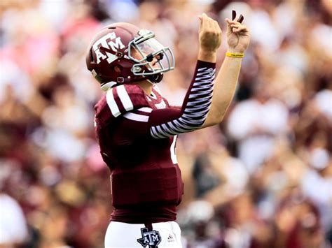 johnny manziel makes hand gestures before and after his first td of the year for the win