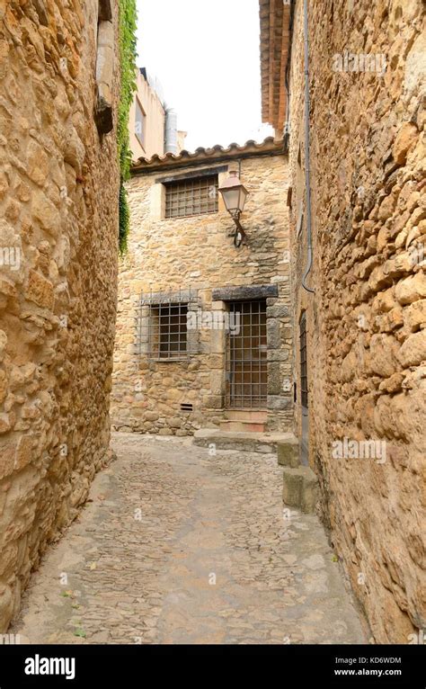 Narrow Alley In The Medieval Village Of Peratallada Located In The