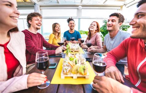 Happy Multicultural People Having Fun Together Drinking Wine At Penthouse On Private Home Party