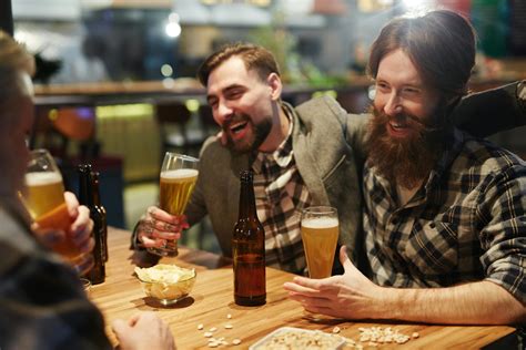 Men Laughing And Drinking Beer · Free Stock Photo