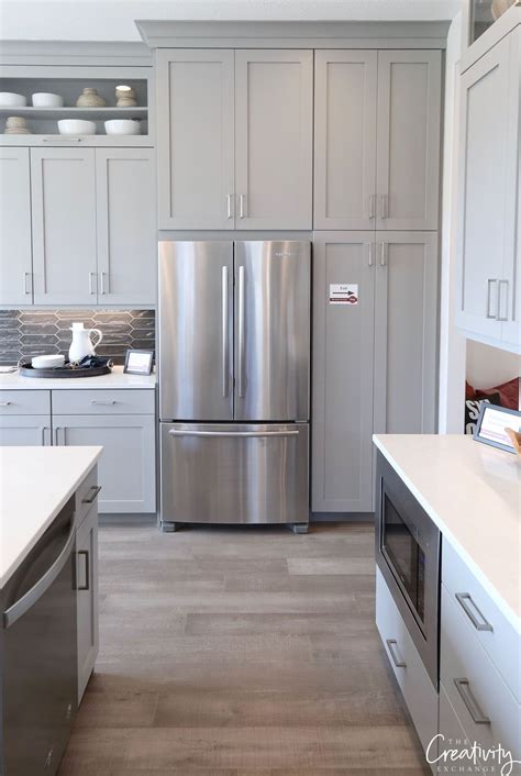 This stain color is a fantastic neutral that allows you to easily work in other colors, or you can keep the palette earth tone and neutral — as was done here — for a cozy and inviting feel. Best Sherwin Williams Gray Paint Color For Kitchen Cabinets | Colorpaints.co