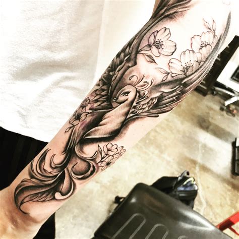 Tattoo style illustration of a phoenix bird rising from fire ashes on game controller phoenix. rise from the ashes - Phoenix tattoo forearm | Phoenix ...
