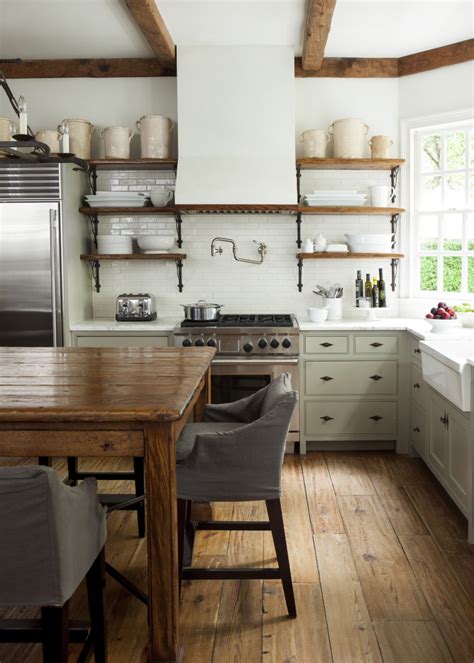White Kitchen With Exposed Beams Open Shelves Farm Table Crocks