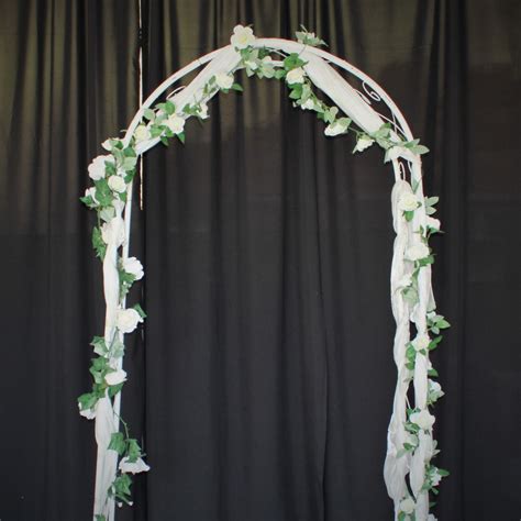 White Wedding Arch With Draping Indoor And Outdoor Ceremonies