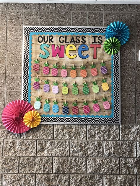 A Bulletin Board With Pineapples And Pinwheels On It