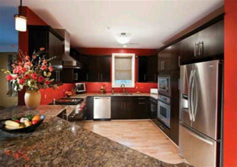 When you think of a personalized kitchen, the cabinets in the kitchen are the first thing that comes to your mind. Red wall kitchen | home - kitchen decor | Pinterest