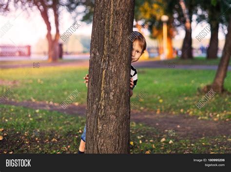 Boy Hides Behind Tree Image And Photo Free Trial Bigstock