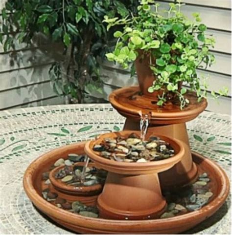 An indoor fountain, right by a bright window, will bring a luxe touch to your home! DIY Clay Pot Water Feature Instructions {Video} | The ...