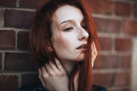 women redhead freckles hair in face looking away pale face parted lips women outdoors