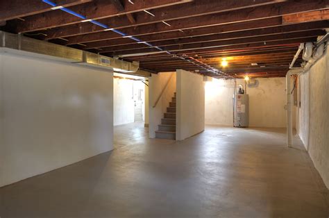 Most unfinished basements have a poured concrete floor. Unfinished Basement | Unfinished basement walls, Basement ...