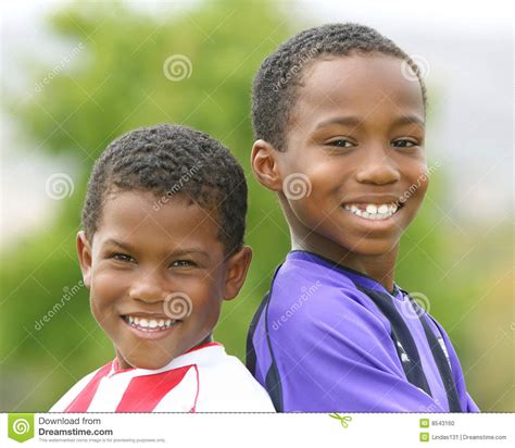 Two African American Boys In Soccer Uniforms Stock Photo Image Of