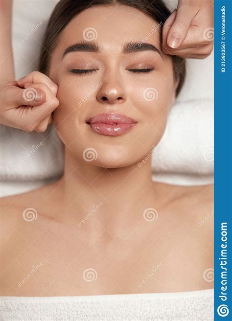 Face Massage Beautiful Of Young Woman Getting Spa Massage Treatment At Beauty Spa Salonspa