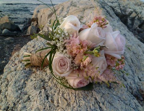 Send flowers to manchester with mimosa flowers. Gorgeous OHara Roses featured in this coastal bouquet ...