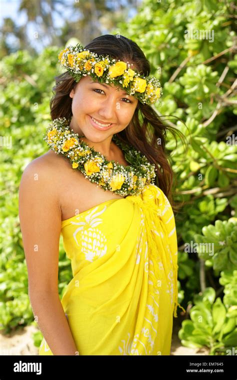 Hawaii Local Girl Wearing Bright Yellow Pareo And Flower Leis Stock