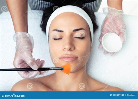 Cosmetologist Making A Chemistry Peeling For Rejuvenating The Face To