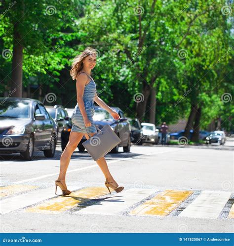 Young Beautiful Woman In A Blue Short Dress Walking On The Road Stock Image Image Of Pretty