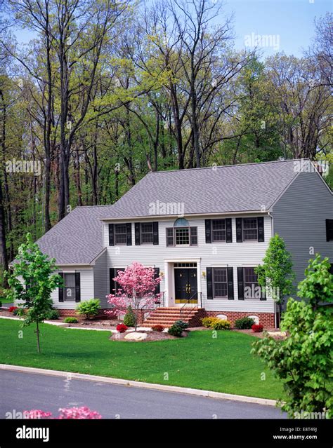 1990s Center Hall Colonial Suburban Home In Spring Stock Photo Alamy