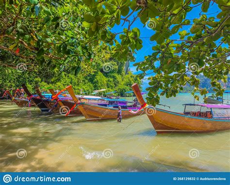 Long Tail Boats Parked On Tropical Railay Beach In Thailand Stock