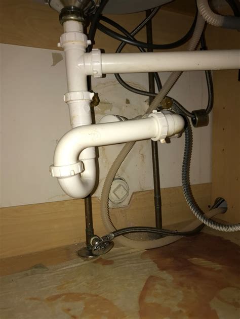 If we had dropped the sink in at this point, there would be sizable gaps on either side. Plumbing in Kitchen Sink Base Cabinet | Terry Love ...