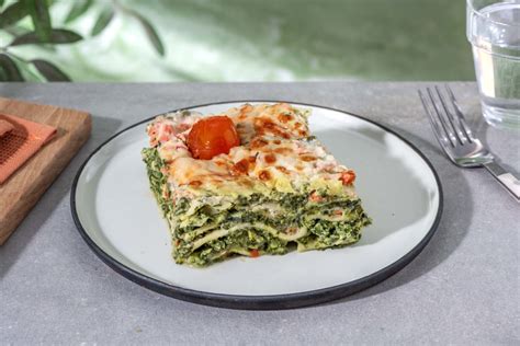 Romige lasagne met gerookte zalm spinazie en tomaat Recept