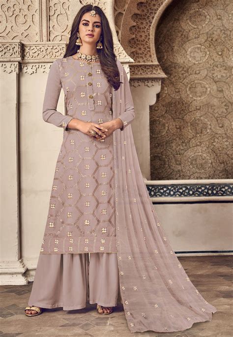 Faux Georgette Pakistani Suit In Light Fawn This Unstitched Attire With Poly Shantoon Lining Is