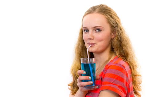 blonde teenage girl drinking soda verb company