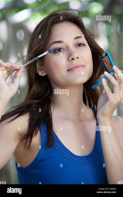Beautiful Young Woman Applying Eyeshadow Stock Photo Alamy