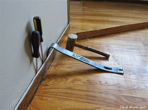 If you've noticed that the floorboards are pushing up against each other along the simply remove the molding and cut a section of flooring between the floor and the walls. Easy Baseboard Install - How To