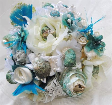Your wedding bouquet is the ultimate bridal accessory—but you don't have to rely on it to make a statement. Books Worth Reading | Shell bouquet, Diy feather decor ...