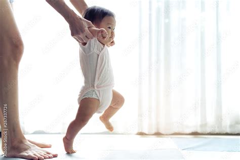 Asian Baby Taking First Steps Walk Forward On The Soft Mat Happy