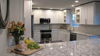 This stunning stone has an off white background with a blue and grey swirl and flecks of tan, brown and black. White Ice Granite Countertops (Pictures, Cost, Pros and Cons)