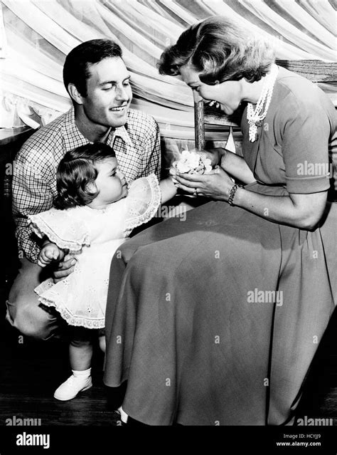 from left george montgomery dinah shore with daughter melissa montgomery on her first birthday