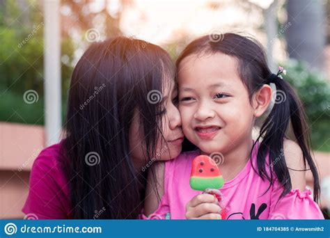 asian mother and her daughter smiling with eating ice cream stock image image of person cute