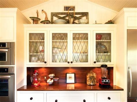 Today i am breaking it down for you and our experience with both open shelving and glass cabinets in the kitchen. Traditional White Kitchen With Leaded Glass Cabinets | HGTV