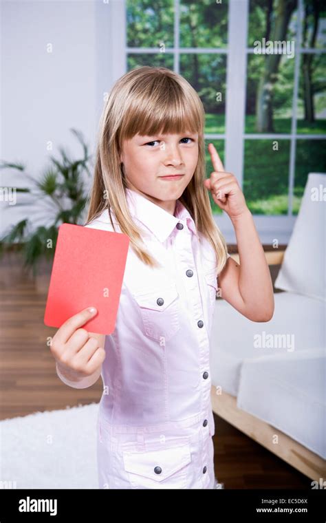 Girl Showing The Red Card Stock Photo Alamy