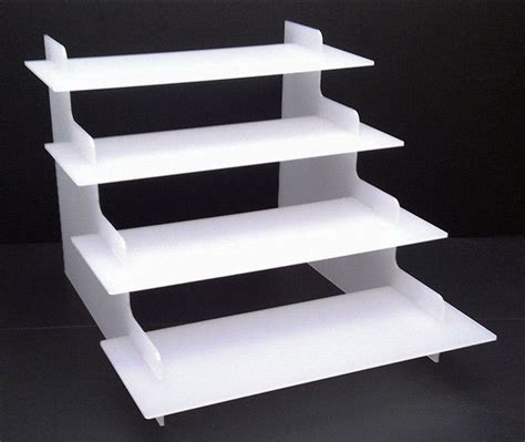 A White Shelf Sitting On Top Of A Black Table