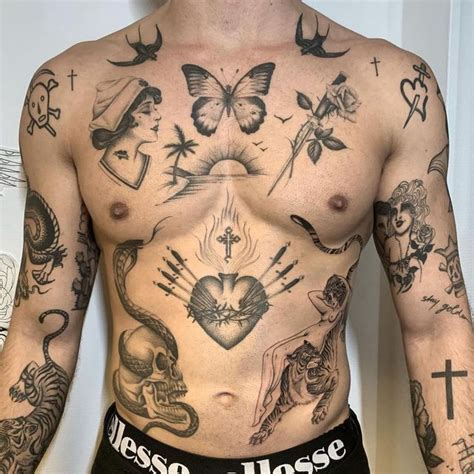 A Man With Many Tattoos On His Chest