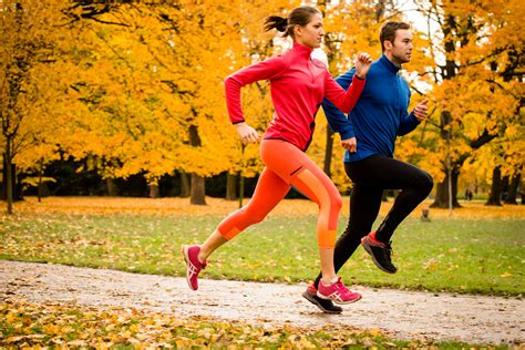Couple Jogging In Autumn Nature Endurance Planet
