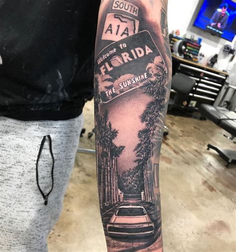 A Man With A Black And White Tattoo On His Arm That Reads Florida The