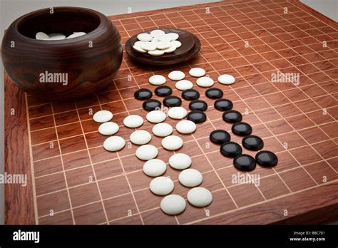 Counters And Board For The Chinese Board Game Go Sometimes Referred