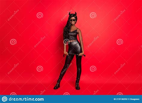 full length photo portrait of african american horned girl with leather whip isolated on bright